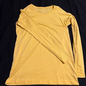 Size 14 Lululemon swiftly tech long sleeve. Yellow.